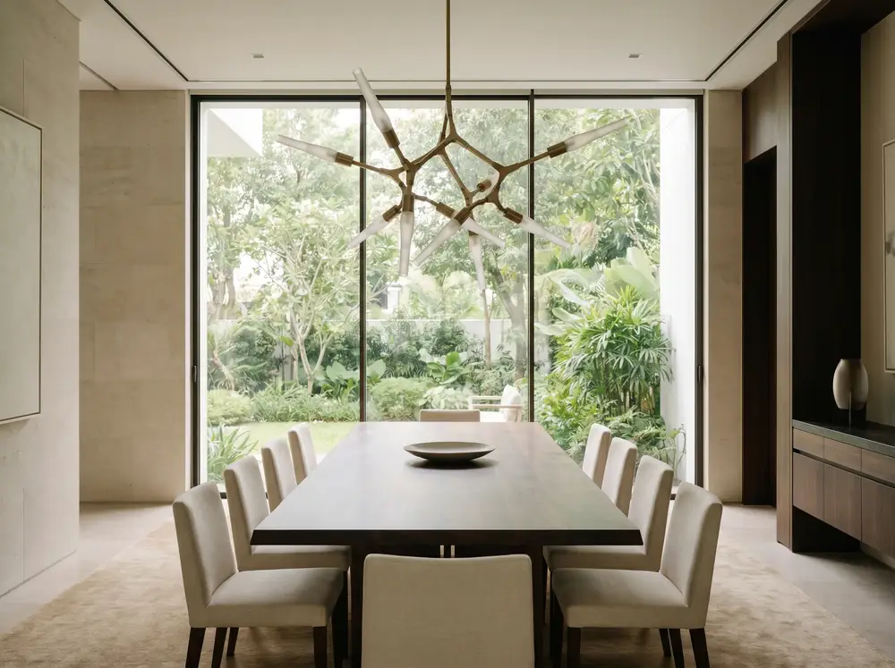 A long family dining table before a garden window. A representative scene.